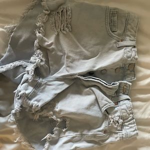 Ripped light blue denim shorts
